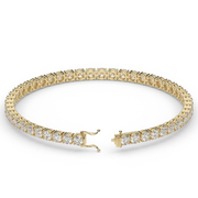 7 Carat Yellow Gold Round Shape Diamond Tennis Bracelet With Prong Setting.